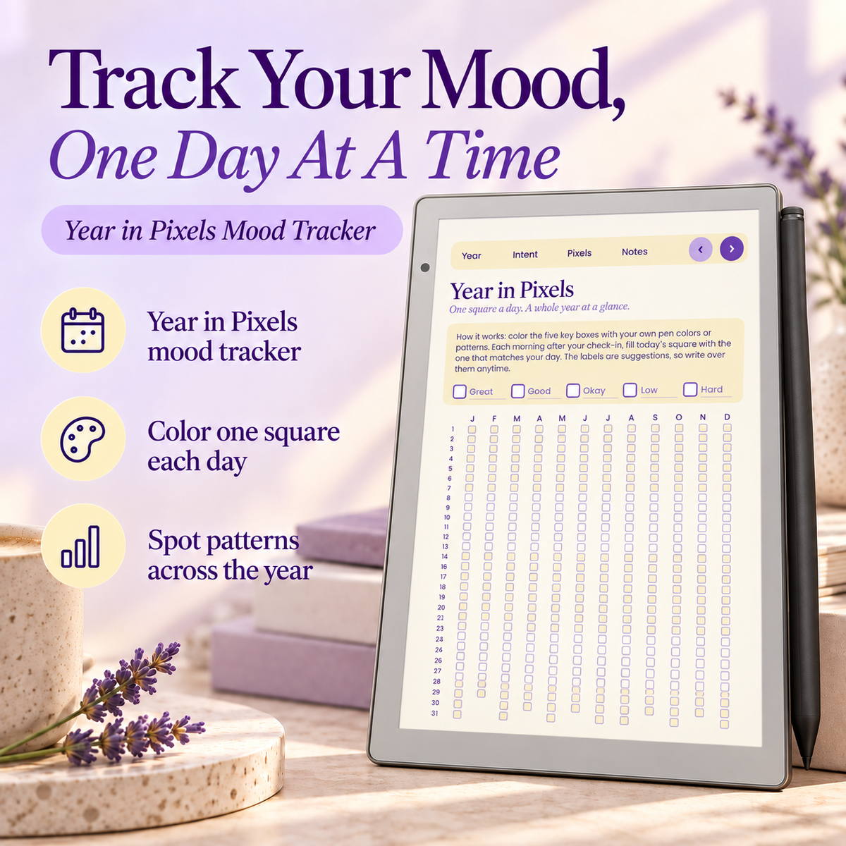 A tablet displaying the Year in Pixels mood tracker app, set on a tabletop with lavender flowers and decorative props. Large promotional text reads 'Track Your Mood, One Day At A Time' and lists features like a year-in-pixels mood tracker, color one square each day, and spot patterns across the year.