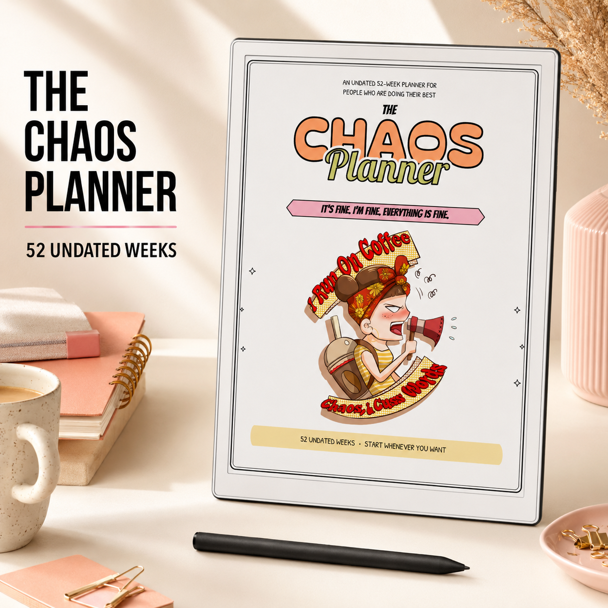 The Chaos Planner digital or printed journal cover displayed upright on a styled desk with a coffee cup, notebooks, and a pen. The cover features a cartoon character and the text '52 Undated Weeks'.